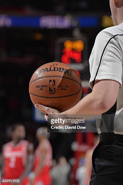 Referee holds the Official NBA Spalding Basketball during the Houston Rockets game against the Philadelphia 76ers at Wells Fargo Center on January...