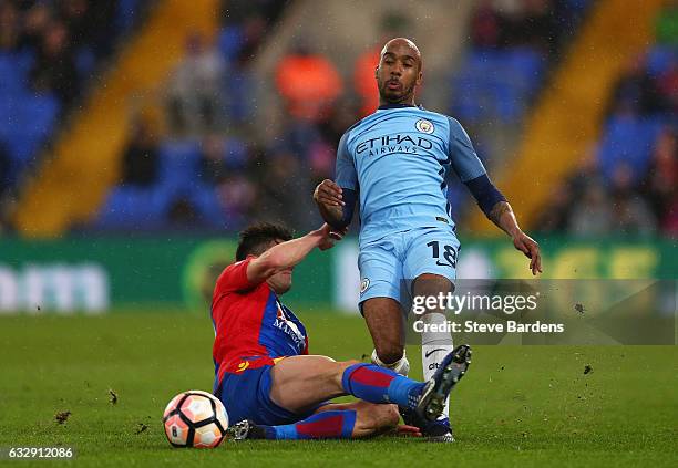 Fabian Delph of Manchester City is tackled by Martin Kelly of Crystal Palace during the Emirates FA Cup Fourth Round match between Crystal Palace and...