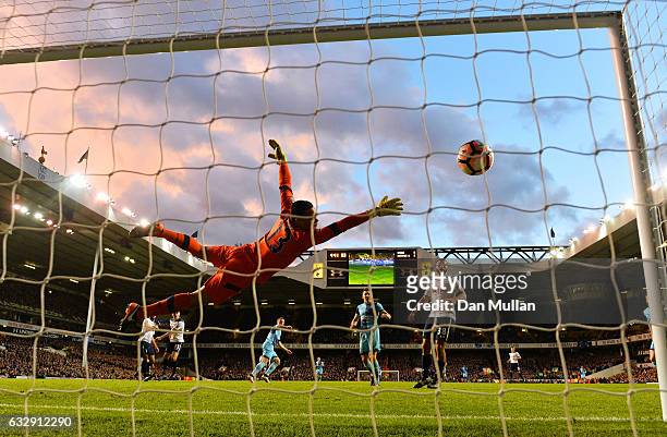 Michel Vorm of Tottenham Hotspur dives as Gary Thompson of Wycombe scores his sides hird goal during the Emirates FA Cup Fourth Round match between...