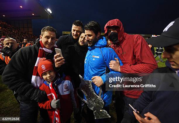 Danny Cowley manager of Lincoln City is surrounded by supporters after his side's 3-1 win in the Emirates FA Cup Fourth Round match between Lincoln...