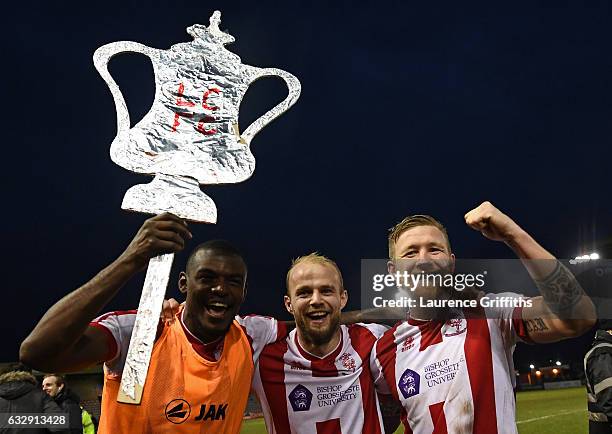 Lincoln City players celebrate their 3-1 win afterthe Emirates FA Cup Fourth Round match between Lincoln City and Brighton and Hove Albion at Sincil...