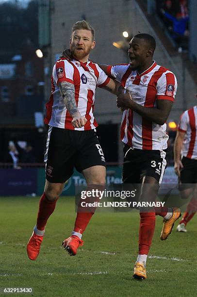 Lincoln City's Irish midfielder Alan Power celebrates scoring his team's first goal from the penalty spot during the English FA Cup fourth round...