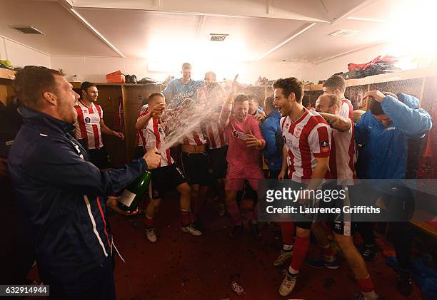 Lincoln City players celebrate their win in the dressing room after the Emirates FA Cup Fourth Round match between Lincoln City and Brighton and Hove...