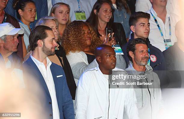 Boyfriend Alexis Ohanian, coach Patrick Mouratoglou, sister Isha Price look on as Serena Williams speaks after winning the Women's Singles Final...