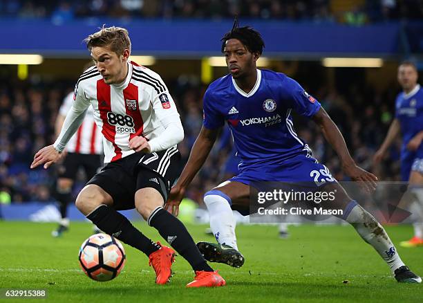 Konstantin Kerschbaumer of Brentford controls the ball under pressure of Nathaniel Chalobah of Chelsea during the Emirates FA Cup Fourth Round match...