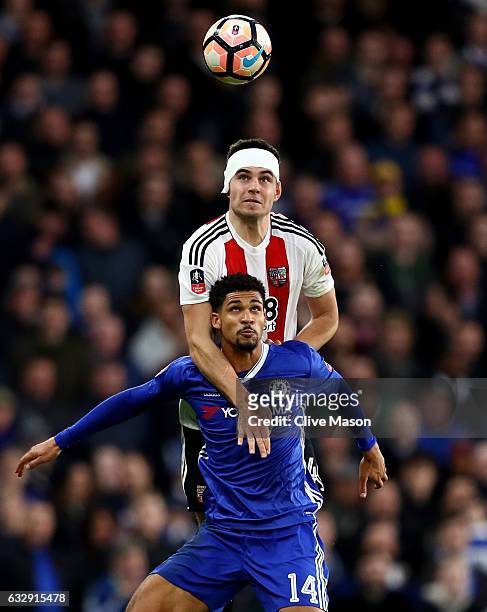 Ruben Loftus-Cheek of Chelsea and John Egan of Brentford compete for the ball during the Emirates FA Cup Fourth Round match between Chelsea and...