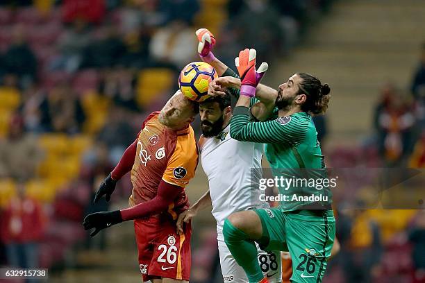 Semih Kaya of Galatasaray vies with Caner Osmanpasa and Fatih Ozturk during the Turkish Spor Toto Super Lig match between Galatasaray and Akhisar...