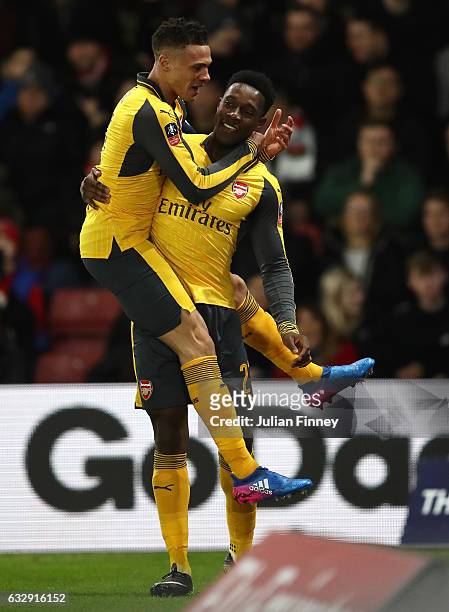 Danny Welbeck of Arsenal celebrates with Kieran Gibbs of Arsenal after scoring his sides first goal during the Emirates FA Cup Fourth Round match...