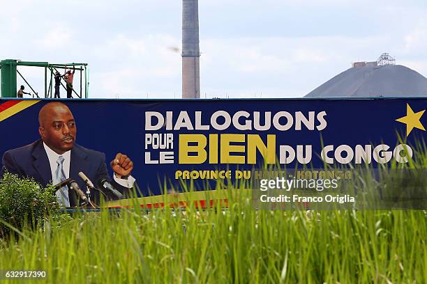 Banner featuring the President of Democratic Republic of Congo Joseph Kabila is seen in front of of a copper and cobalt mine on January 16, 2017 in...