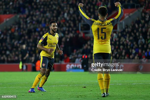 Theo Walcott of Arsenal celebrates after scoring his sides fourth goal with Alex Oxlade-Chamberlain of Arsenal during the Emirates FA Cup Fourth...