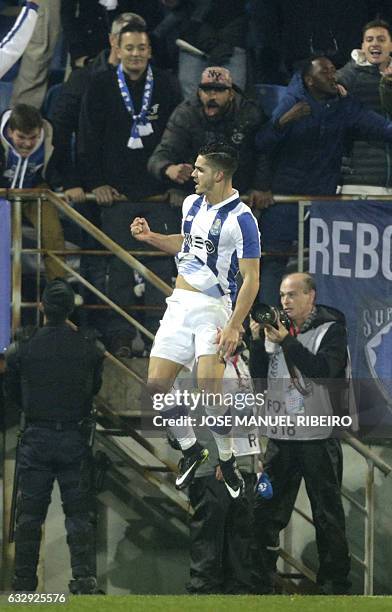 Porto's Brazilian defender Alex Telles celebrates his goal during the Portuguese league football match GD Estoril Praia vs FC Porto at the Antonio...