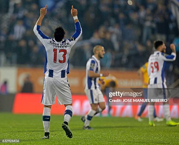 Porto's Brazilian defender Alex Telles celebrates his goal during the Portuguese league football match GD Estoril Praia vs FC Porto at the Antonio...