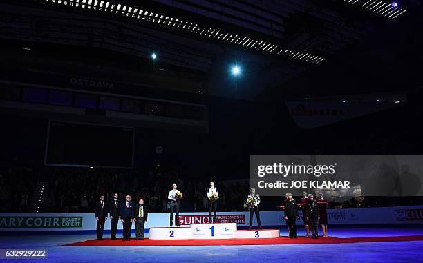 Winner Spain's Javier Fernandez stands on the podium next to second placed Russia's Maxim Kovtun and Russia's Mikhail Kolyada during the winners...