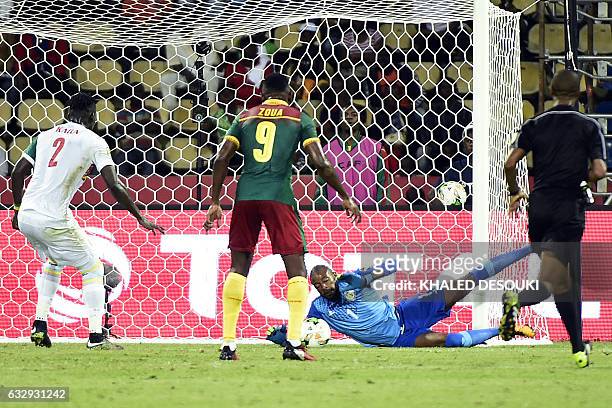 Senegal's goalkeeper Abdoulaye Diallo blocks a shot on goal by Cameroon's forward Jacques Zoua during the 2017 Africa Cup of Nations quarter-final...