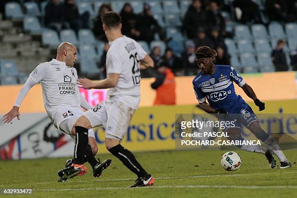 Bastia's French midfielder Allan Saint Maximin vies with Caen's French defender Alaeddine Yahia before scoring a goal during the French L1 football...