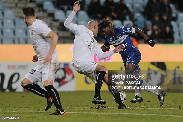Bastia's French midfielder Allan Saint Maximin vies with Caen's French defender Alaeddine Yahia before scoring a goal during the French L1 football...
