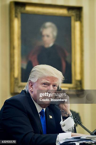 President Donald Trump speaks on the phone with Malcolm Turnbull, Australia's prime minister, during the first official phone talks in the Oval...