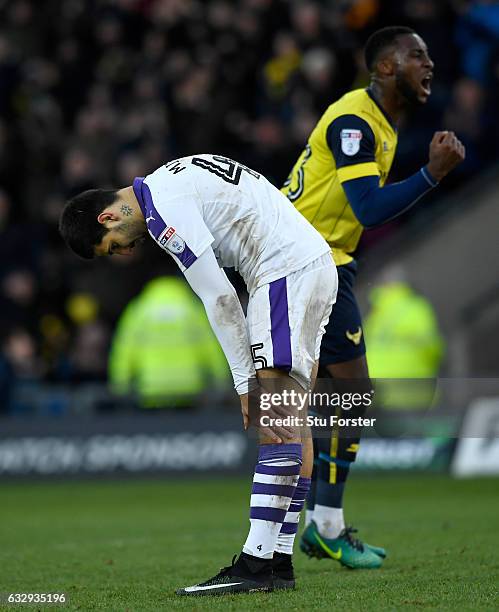 Oxford player Chey Dunkley celebrates as Aleksander Mitrovic of Newcastle United reacts after missing his penalty during The Emirates FA Cup Fourth...