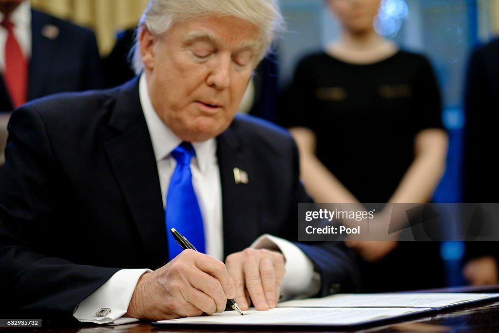 President Trump Signs Executive Orders In The Oval Office