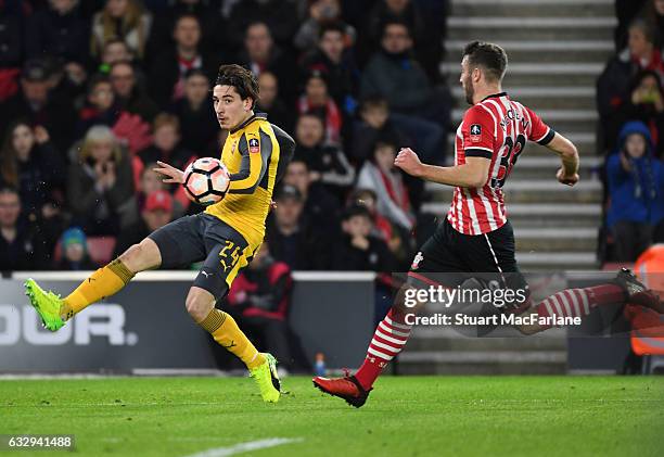 Hector Belerin of Arsenal breaks past Sam McQueen of Southampton during the Emirates FA Cup Fourth Round match between Southampton and Arsenal at St...