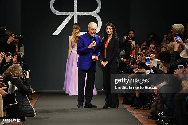 Mayor of Rome Virginia Raggi and designer Renato Balestra attend the runway of the 'Renato Balestra' fashion show during AltaRoma January 2017 on...