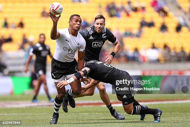 Osea Kolinisau of Fiji looks to pass in the Cup Quarter Final match between New Zealand and Fiji during the 2017 Wellington Sevens at Westpac Stadium...