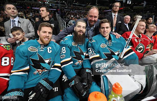 Joe Pavelski, Brent Burns, coach Peter DeBoer and goaltender Martin Jones of the San Jose Sharks pose for a photo in the bench area during the 2017...