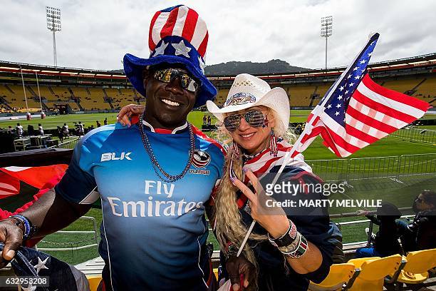 Sevens fans strike a pose during day two of the IRB rugby Sevens at Westpac Stadium in Wellington on January 29, 2017. / AFP / Marty MELVILLE