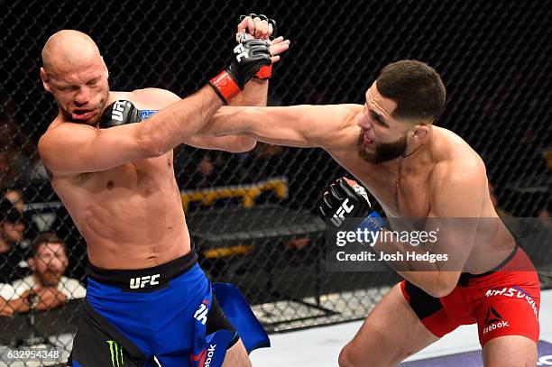 Jorge Masvidal punches Donald Cerrone in their welterweight bout during the UFC Fight Night event at the Pepsi Center on January 28, 2017 in Denver,...