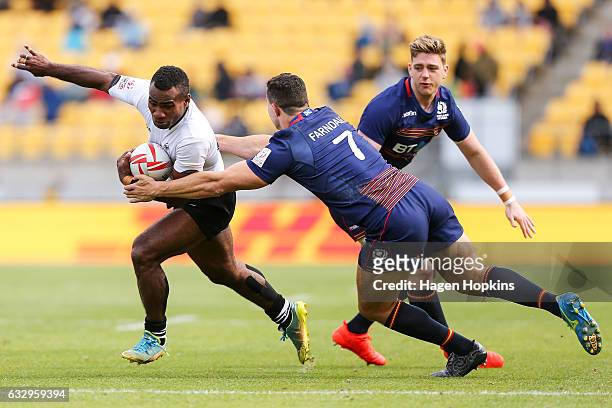 Jerry Tuwai of Fiji is tackled by Jamie Farndale of Scotland in the Cup Semi Final match between Fiji and Scotland during the 2017 Wellington Sevens...
