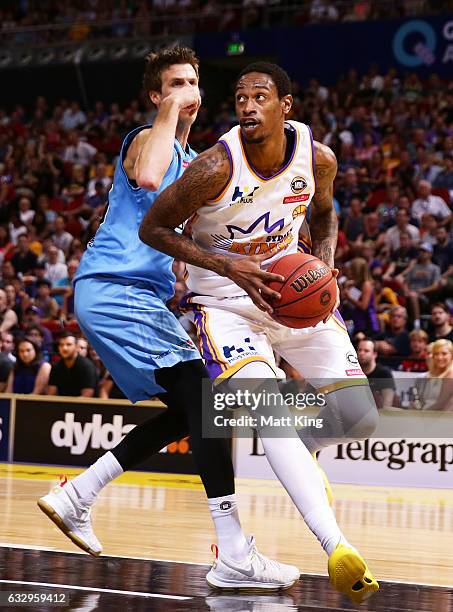 Greg Whittington of the Kings drives to the basket under pressure from Thomas Abercrombie of the Breakers during the round 17 NBL match between the...