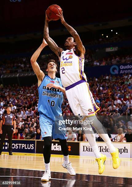 Greg Whittington of the Kings drives to the basket under pressure from Thomas Abercrombie of the Breakers during the round 17 NBL match between the...