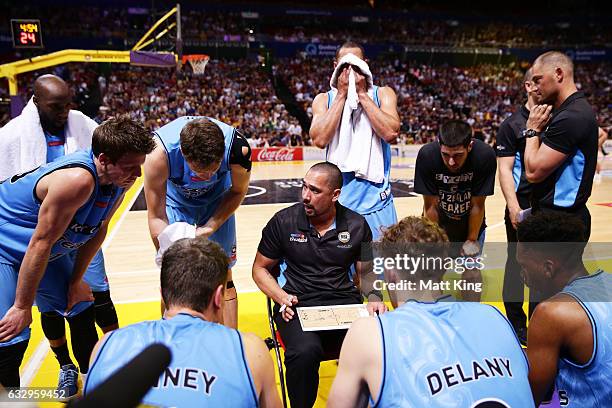 Breakers coach Paul Henare speaks to his players during a time out during the round 17 NBL match between the Sydney Kings and the New Zealand...