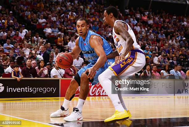 Greg Whittington of the Kings defends against Mika Vukona of the Breakers during the round 17 NBL match between the Sydney Kings and the New Zealand...