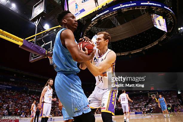 Paul Carter of the Breakers wrestles with Tom Garlepp of the Kings during the round 17 NBL match between the Sydney Kings and the New Zealand...
