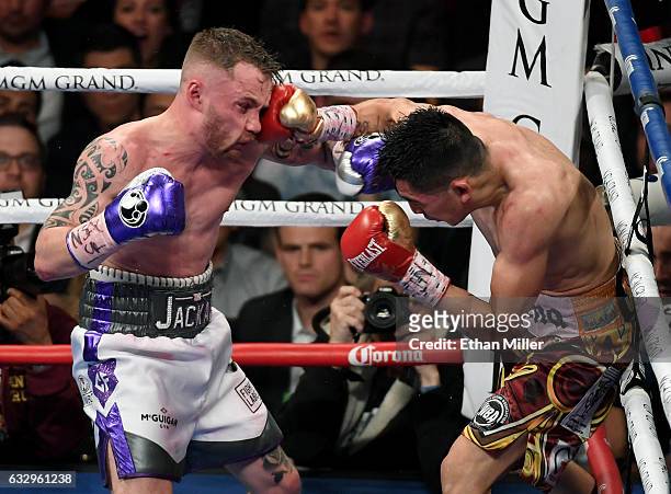 Leo Santa Cruz hits Carl Frampton with a right in the 10th round of their WBA featherweight title fight at MGM Grand Garden Arena on January 28, 2017...