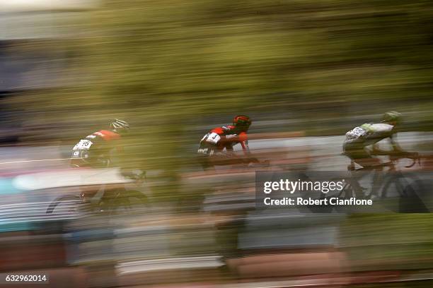 Lachlan Morton of Australia and Team Dimension Data is chased by Amael Moinard of France and BMC Racing Team and Koen De Kort of the Netherkands and...