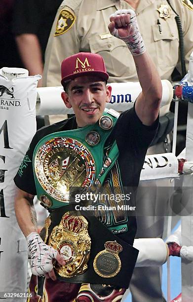 Leo Santa Cruz celebrates as he leaves the ring after defeating Carl Frampton by majority decision to win their WBA featherweight title fight at MGM...