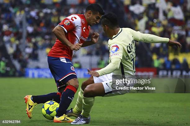 Martin Bravo of Veracruz struggles for the ball with Cecilio Dominguez of America during the 4th round match between America and Veracruz as part of...