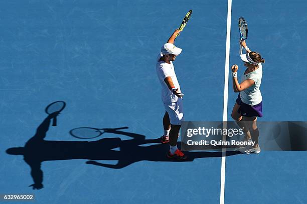 Abigail Spears and Juan Sebastian Cabal of Columbia celebrate championship point in their Mixed Doubles Final against Sania Mirza of India and Ivan...