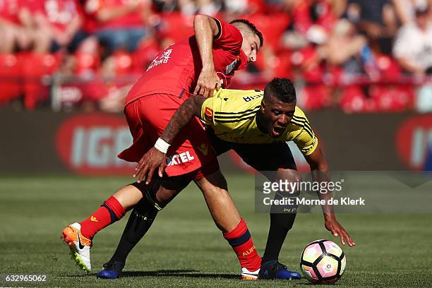 Iacopo La Rocca of Adelaide United tackles Rolieny Bonevacia of Wellington Phoenix during the round 17 A-League match between Adelaide United and the...
