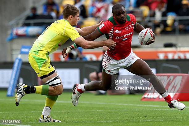 Willy Ambaka of Kenya is tackled during the Trophy final against Kenya during the 2017 Wellington Sevens at Westpac Stadium on January 29, 2017 in...
