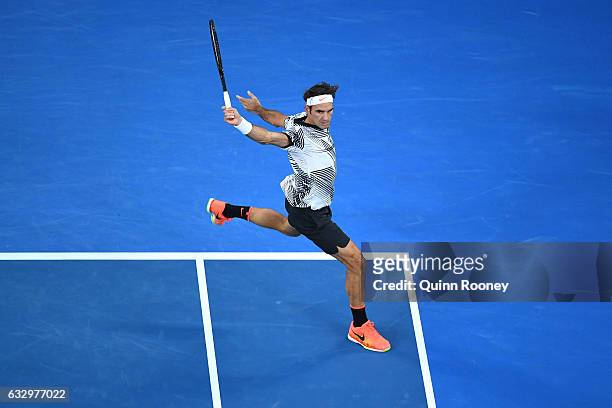 Roger Federer of Switzerland plays a backhand in his Men's Final match against Rafael Nadal of Spain on day 14 of the 2017 Australian Open at...