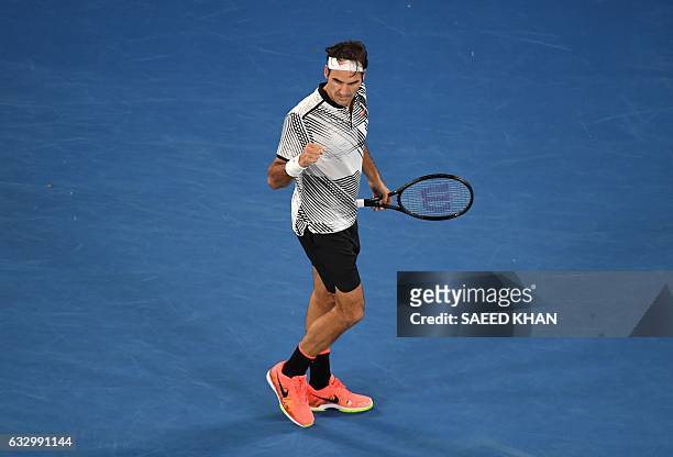 Roger Federer of Switzerland celebrates a point in the fifth set against Rafael Nadal of Spain during the men's singles final on day 14 of the...