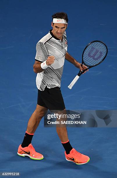 Roger Federer of Switzerland celebrates a point in the fifth set against Rafael Nadal of Spain during the men's singles final on day 14 of the...