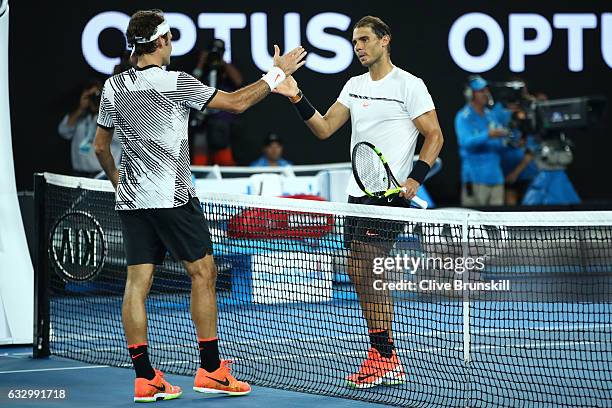 Roger Federer of Switzerland is congratulated by Rafael Nadal of Spain after winning their Men's Final match against on day 14 of the 2017 Australian...