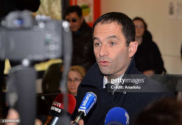 French former education minister and candidate for the left-wing primaries Benoit Hamon speaks to media after casting his ballot during the second...