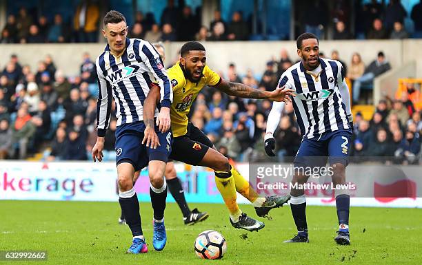 Jerome Sinclair of Watford and Shaun Williams of Millwall battle for possession during The Emirates FA Cup Fourth Round match between Millwall and...