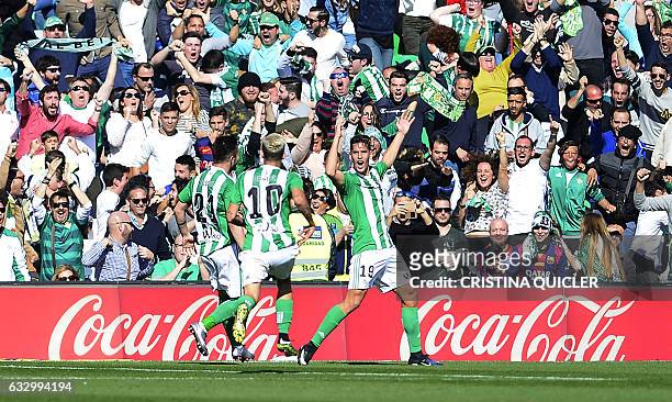 Betis' forward Alex Alegria celebrates after scoring a goal during the Spanish league football match Real Betis vs FC Barcelona at the Benito...