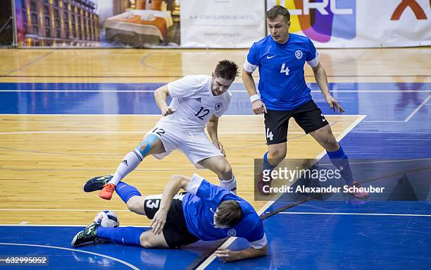Adam Fiedler of Germany challenges Oleg Kaljurand of Estonia and Sergei Kostin of Estonia during the UEFA Futsal European Championship Qualifying...